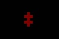 Red puzzle piece or two-barred cross isolated on black background Royalty Free Stock Photo