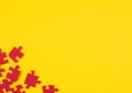 Red puzzle pieces on a yellow background. Place for your text Royalty Free Stock Photo