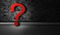 Red question mark on grey cement background with space on the right side. Royalty Free Stock Photo
