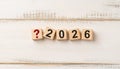 Red Question Mark Icon with Wooden Blocks Spelling 2026 Representing Uncertainty or Planning the Future Royalty Free Stock Photo