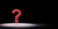 Red question mark Spotlighted on Black Background Royalty Free Stock Photo