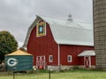 Red quilt barn and Green Bay packers symbol on silo Royalty Free Stock Photo