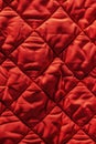 Red quilt with a pattern of squares Royalty Free Stock Photo
