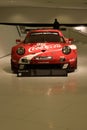 Red racecar with sponsors Royalty Free Stock Photo