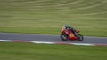 A red racing bike speeding round corners Royalty Free Stock Photo