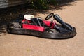 Red racing kart without a racer in a parking lot of a circuit for a ring race Royalty Free Stock Photo