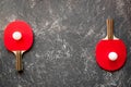 Red racket for ping pong ball gray background top view Royalty Free Stock Photo