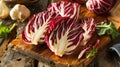 Red radicchio leaves on a rustic wooden background. Fresh produce and salad ingredient concept