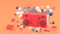 Red radio amidst colorful balls on an orange background. Royalty Free Stock Photo