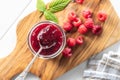 Red rasberries jam in jar and ripe raspberries Royalty Free Stock Photo