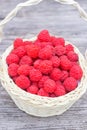 Red raspberries. Raspberries in basket on the table. Ripe berry in wicker basket. Royalty Free Stock Photo