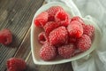 Red raspberries in white bowl Royalty Free Stock Photo