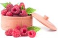 Red raspberries in a wooden bowl isolated on white background Royalty Free Stock Photo
