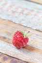 Red raspberry on old vintage wooden table. Royalty Free Stock Photo