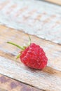 Red raspberry on old vintage wooden table. Royalty Free Stock Photo