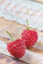 Red raspberry on old vintage wooden table. Royalty Free Stock Photo