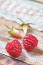 Red raspberry on old vintage wooden table. Royalty Free Stock Photo