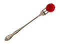 Red raspberry on a small fruit fork on a white background top view