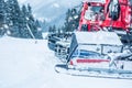 Red ratrac snowcat at work on on the ski slope Royalty Free Stock Photo