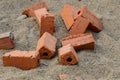 Red raw brick on sand for building instruction Royalty Free Stock Photo