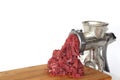 Ground beef comes out of meat grinder on cutting board Royalty Free Stock Photo