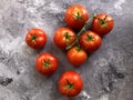 Red, raw, organic tomatoes on the vine