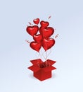 Red realistic glossy foil balloons in the shape of a heart fly out of the box. Holiday, Sale and holiday decorations. Birthday. Royalty Free Stock Photo