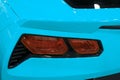 Red Rear light on a modern blue sport car with reflection. The Closeup Back Red Tail light car. Royalty Free Stock Photo