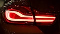 Red Rear light on a modern car with reflection. The Closeup Back Red Tail light car. Royalty Free Stock Photo