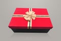 A red rectangular gift box with gold bow