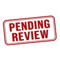 Red rectangular stamp with pending review text isolated on white background Royalty Free Stock Photo