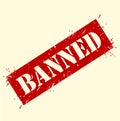 A red rectangular stamp with the word banned in white letters on a cream colored background with splatters Royalty Free Stock Photo