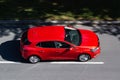 Red Renault Megane 4th generation hatchback (BFB series) with motion blur effect