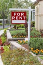 Red For Rent Real Estate Sign in Front of House Royalty Free Stock Photo