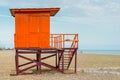 Red rescue tower on an empty beach Royalty Free Stock Photo
