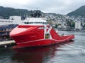 Red research vessel in a Norwegian port