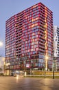 Red residential tower in the blue hour