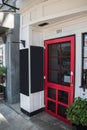 Red restaurant door with a closed sign in the window. There are two chalk blank boards near the door. Royalty Free Stock Photo