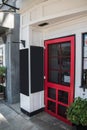 Red restaurant door with a closed sign in the window. There are two chalk blank boards near the door. Royalty Free Stock Photo