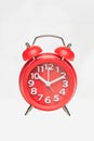 Red retro alarm clock with digital dial and hour hands on white background Royalty Free Stock Photo