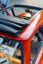 A red retro car with a convertible roof and leather seats. Royalty Free Stock Photo