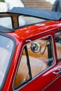 A red retro car with a convertible roof and leather seats. Royalty Free Stock Photo