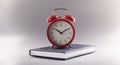 Red retro clock stand on top of closed book or diary, time to study, time to learn new information Royalty Free Stock Photo