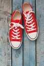 Red retro sneakers, close-up, on a blue wooden background Royalty Free Stock Photo