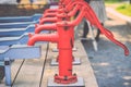 Red retro style hand water pump Royalty Free Stock Photo