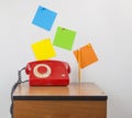 Red retro telephone on wooden nightstand Royalty Free Stock Photo