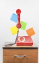 Red retro telephone on wooden nightstand Royalty Free Stock Photo