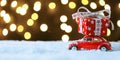 Red retro toy car delivering Christmas or New Year gifts Royalty Free Stock Photo