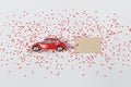 Red retro toy car with a paper card. Valentine`s day, 8 March, Happy Women`s Day Royalty Free Stock Photo