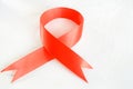 Red ribbon as a symbol of the world day of hemophilia.